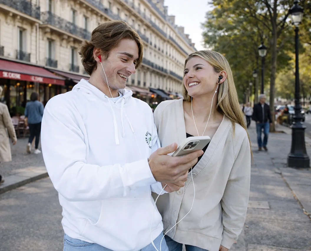 Couple exploring Paris while sharing music with loveBuds